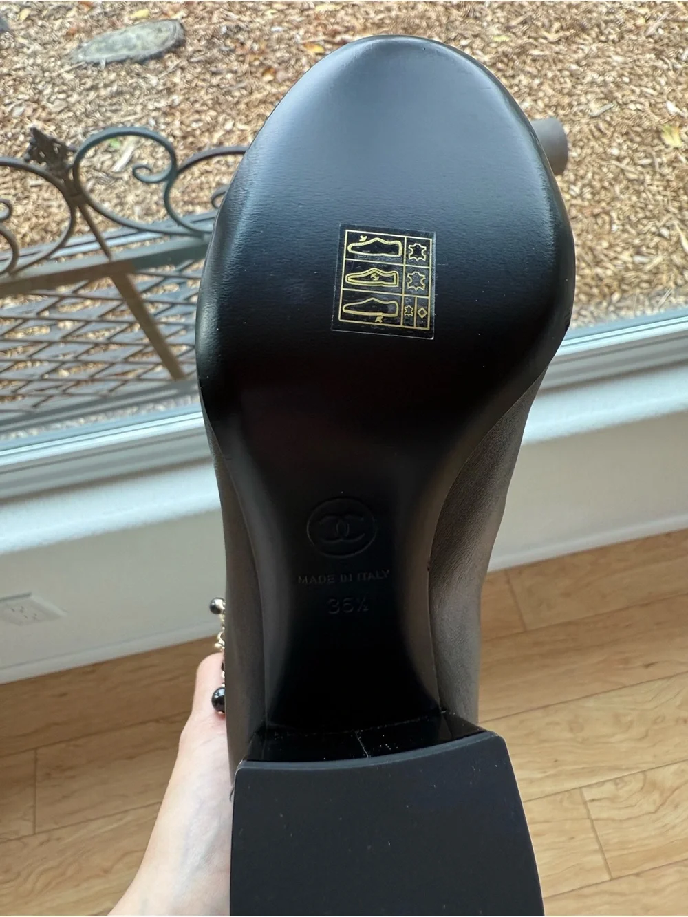 CHANEL Black Over-the-Knee Leather Boots with Chain Charm Trim